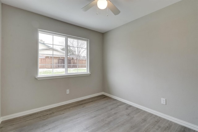 unfurnished room with ceiling fan and light hardwood / wood-style flooring