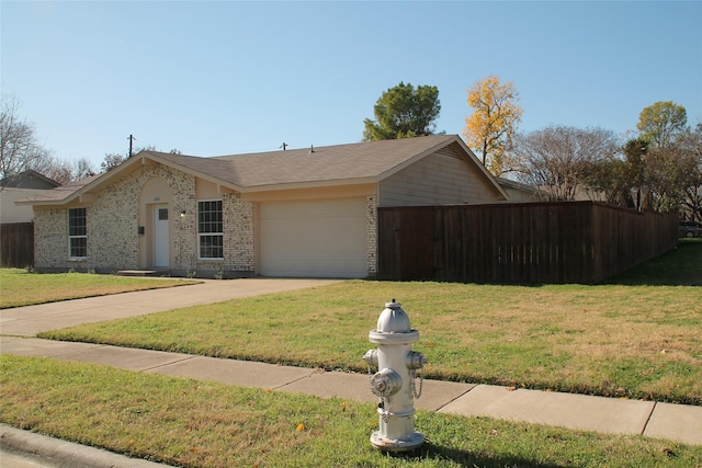 single story home featuring a front yard and a garage