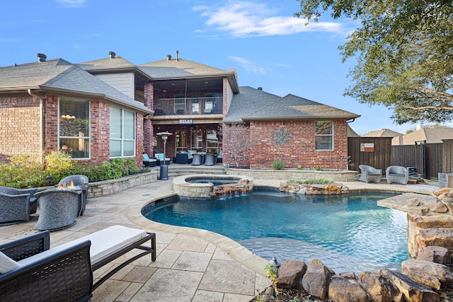 view of swimming pool with an in ground hot tub, a patio area, and outdoor lounge area