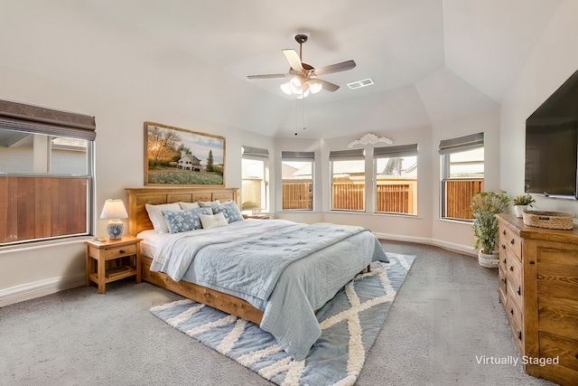 carpeted bedroom featuring ceiling fan and vaulted ceiling