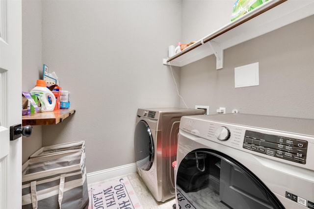 washroom featuring washer and dryer