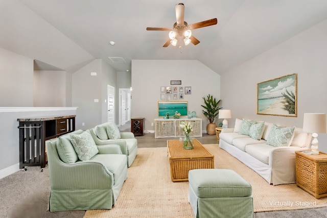 living room featuring ceiling fan and lofted ceiling