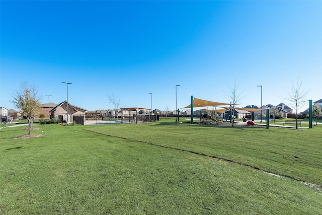 view of home's community with a lawn