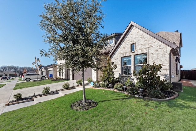 view of front of house featuring a front yard and a garage