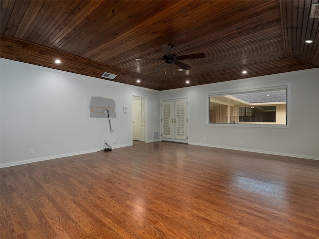 unfurnished room featuring hardwood / wood-style flooring, ceiling fan, wooden ceiling, and french doors