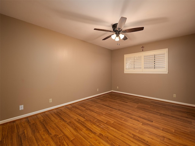 empty room with wood-type flooring and ceiling fan