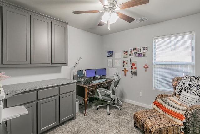 office with ceiling fan and light carpet