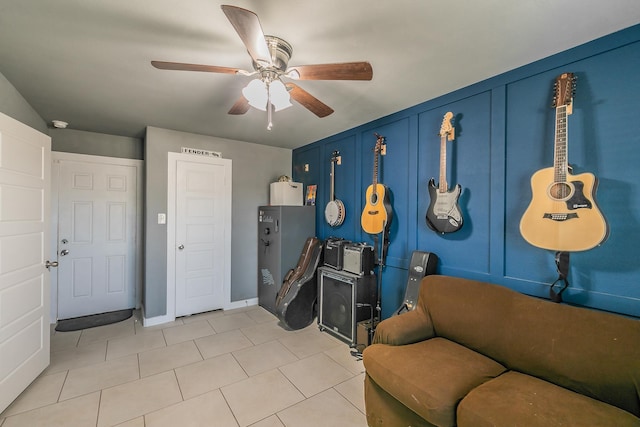 interior space with ceiling fan