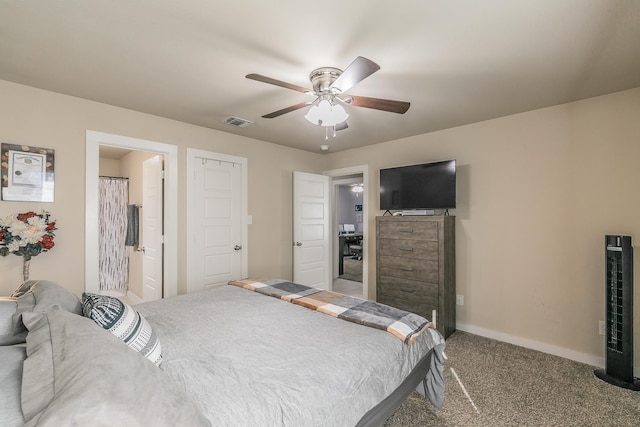 carpeted bedroom with ceiling fan and ensuite bathroom