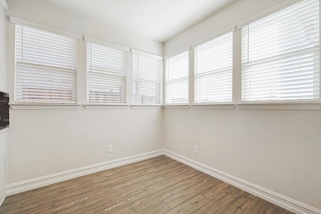 unfurnished room featuring hardwood / wood-style floors