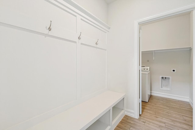 mudroom with light hardwood / wood-style floors and washer / clothes dryer