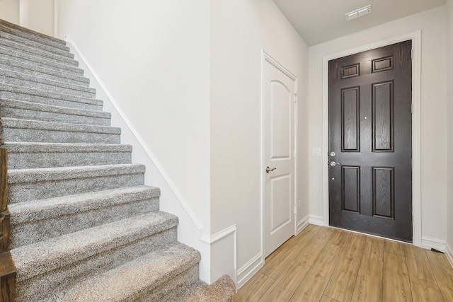 entrance foyer with light hardwood / wood-style floors