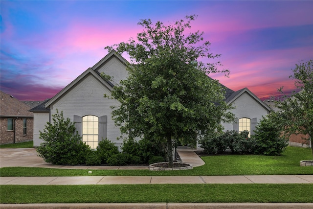 view of front of house with a yard