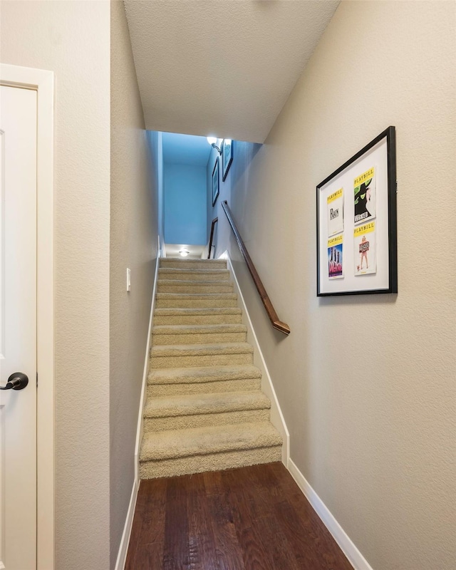 staircase featuring hardwood / wood-style floors