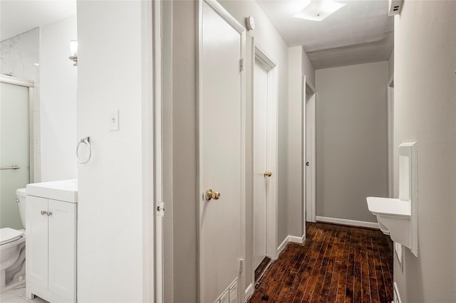 bathroom featuring hardwood / wood-style floors, vanity, toilet, and an enclosed shower