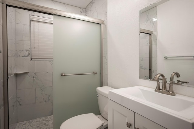 bathroom with vanity, toilet, and walk in shower