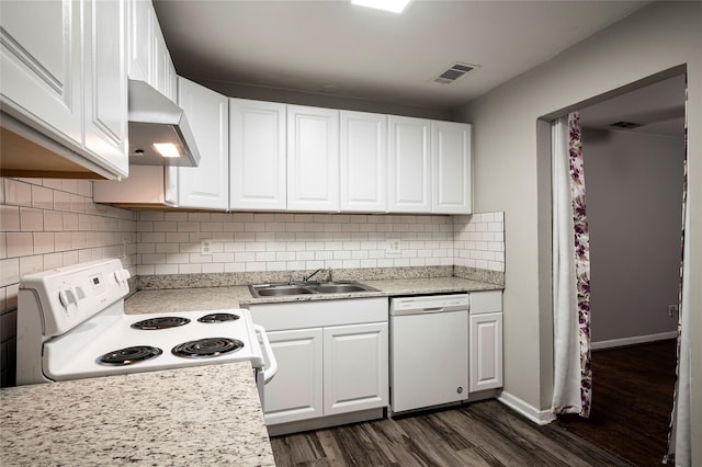 kitchen with light stone counters, white appliances, sink, dark hardwood / wood-style floors, and white cabinetry