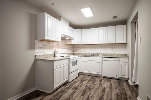 kitchen featuring white appliances, white cabinetry, and sink