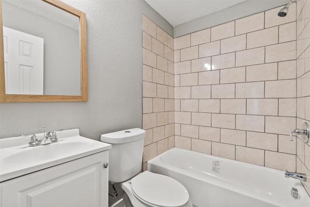 full bathroom with tiled shower / bath combo, toilet, and vanity