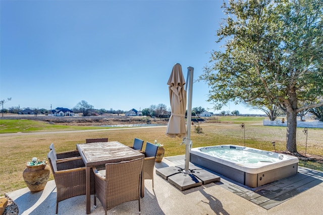 view of patio / terrace with a hot tub