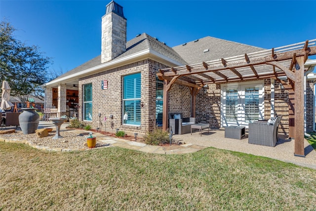 back of property featuring a pergola, a patio area, and a lawn