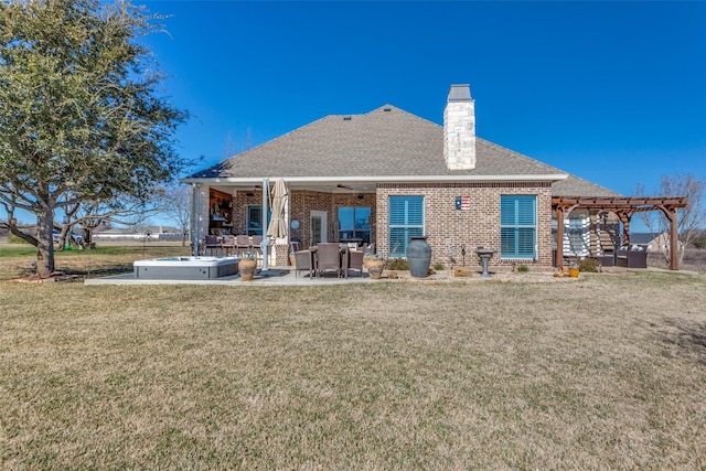 rear view of property with a patio area, a hot tub, a yard, a pergola, and ceiling fan