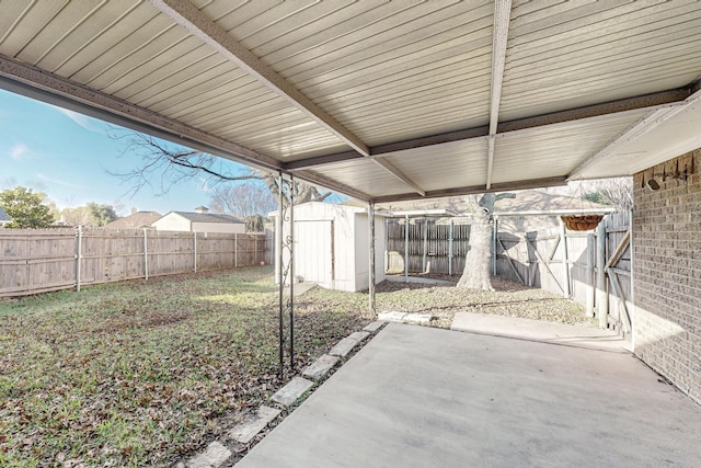 view of patio with a storage shed