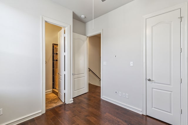 unfurnished bedroom featuring dark hardwood / wood-style flooring