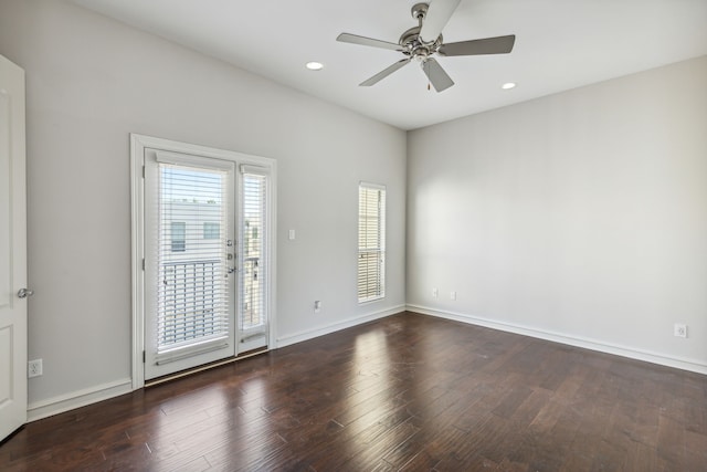 unfurnished room featuring ceiling fan and dark hardwood / wood-style floors