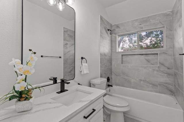 full bathroom featuring toilet, washtub / shower combination, and vanity