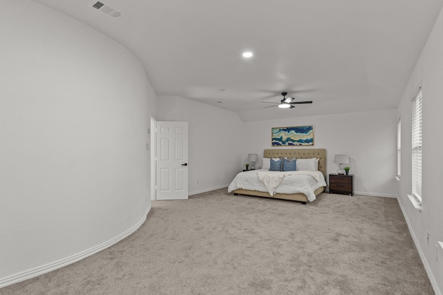 unfurnished bedroom with light carpet, baseboards, visible vents, and a ceiling fan