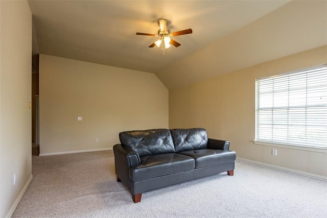 living room with vaulted ceiling, ceiling fan, and carpet floors