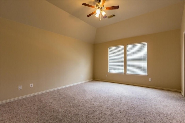 empty room featuring vaulted ceiling, ceiling fan, and carpet