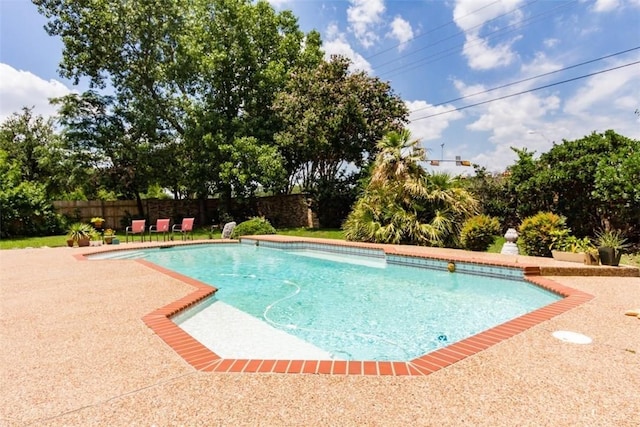 view of swimming pool with a patio