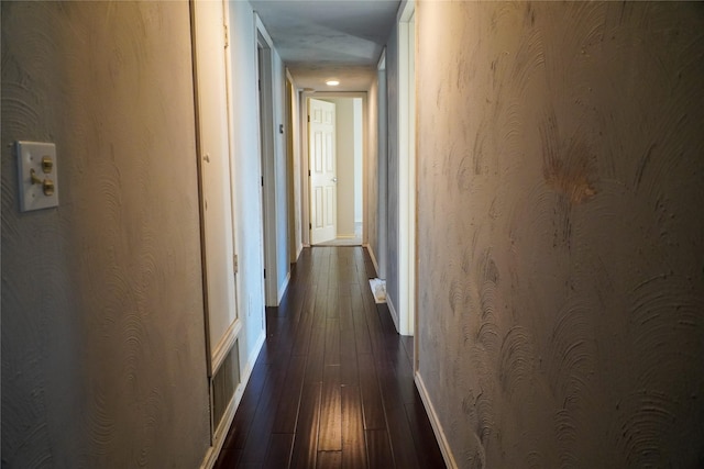 hall with dark hardwood / wood-style flooring