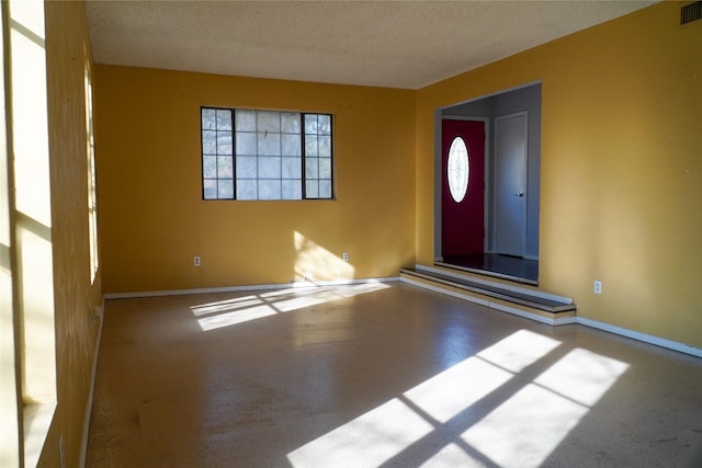 entrance foyer featuring a textured ceiling