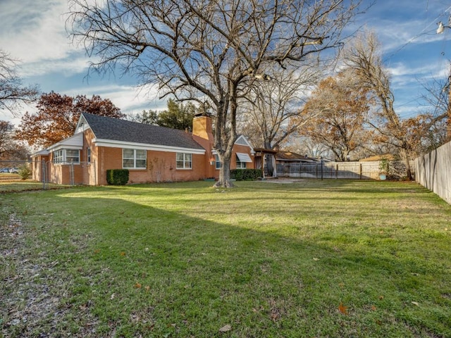 view of yard with a fenced backyard