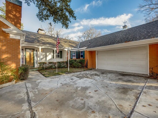 single story home featuring a garage