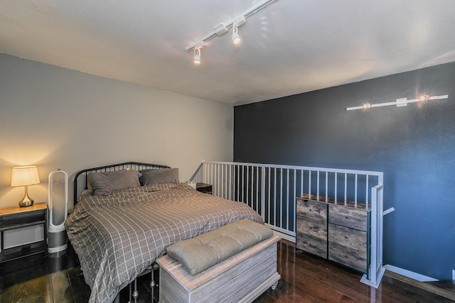 bedroom featuring dark hardwood / wood-style floors