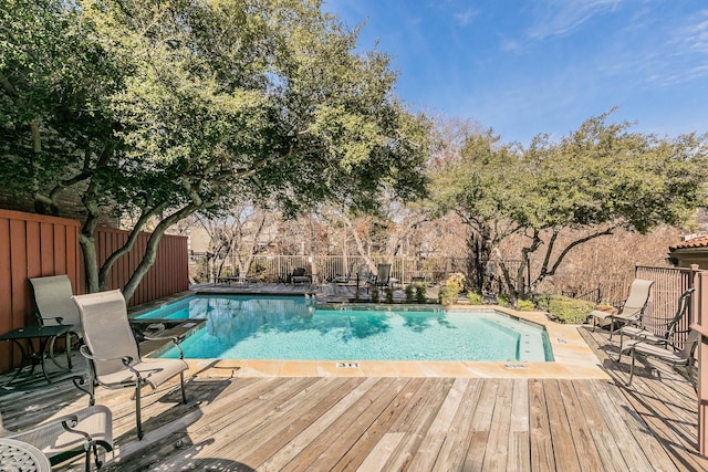 view of pool featuring a wooden deck