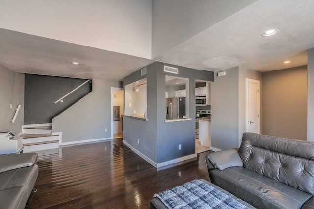 living room with dark hardwood / wood-style floors