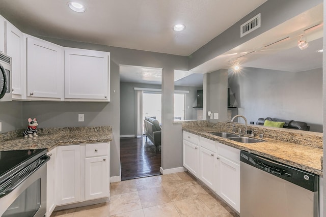 kitchen with sink, white cabinets, and stainless steel appliances