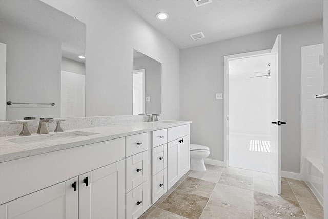 full bathroom with vanity, ceiling fan, toilet, and shower / tub combination