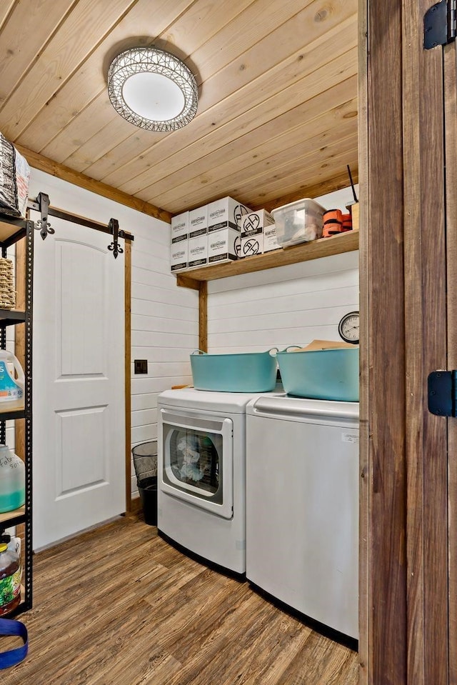 washroom featuring independent washer and dryer, wood ceiling, wood walls, and wood-type flooring