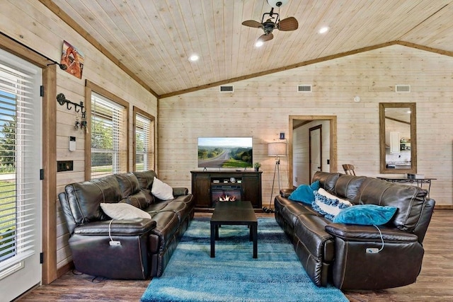 living room with hardwood / wood-style flooring, wooden ceiling, wooden walls, and vaulted ceiling