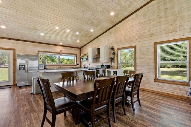 dining space with wood walls, wooden ceiling, and dark hardwood / wood-style floors