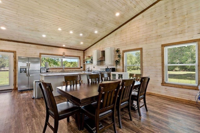 dining room featuring dark wood-type flooring, a wealth of natural light, and wooden ceiling