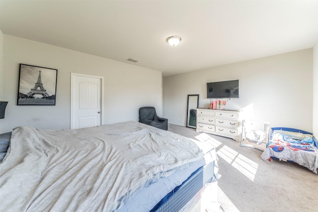 bedroom featuring light colored carpet