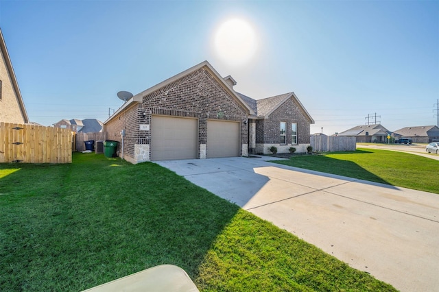 view of front of home featuring a front yard and a garage