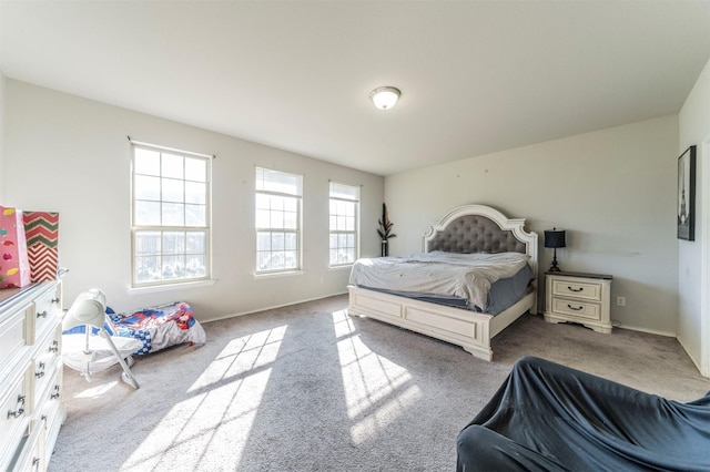 bedroom featuring light carpet